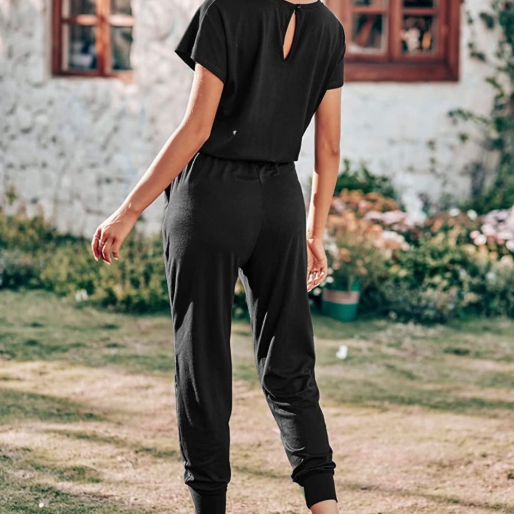 Black, one piece t-shirt jumpsuit. Cropped legs & keyhole back